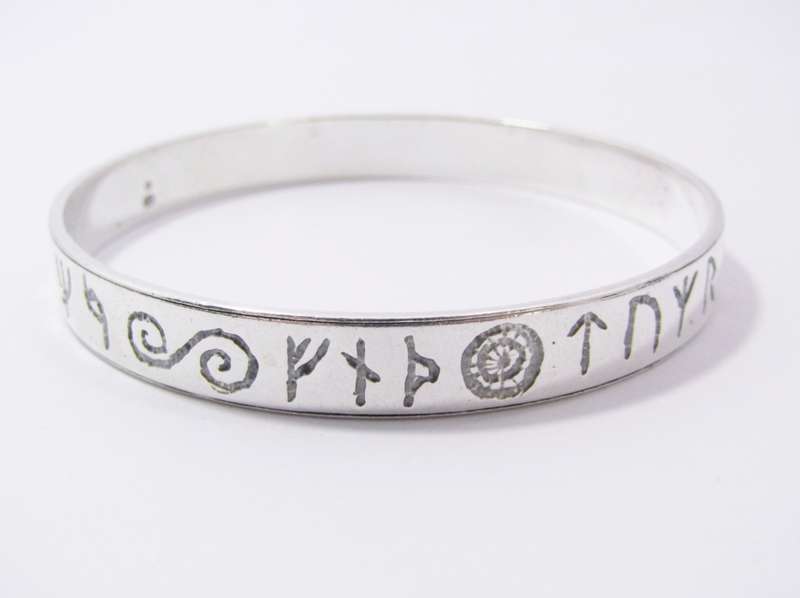 A Stunning Rustic Runic Design Bangle in Sterling Silver.