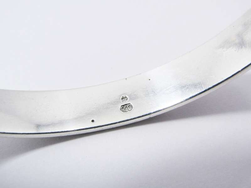 A Stunning Rustic Runic Design Bangle in Sterling Silver.