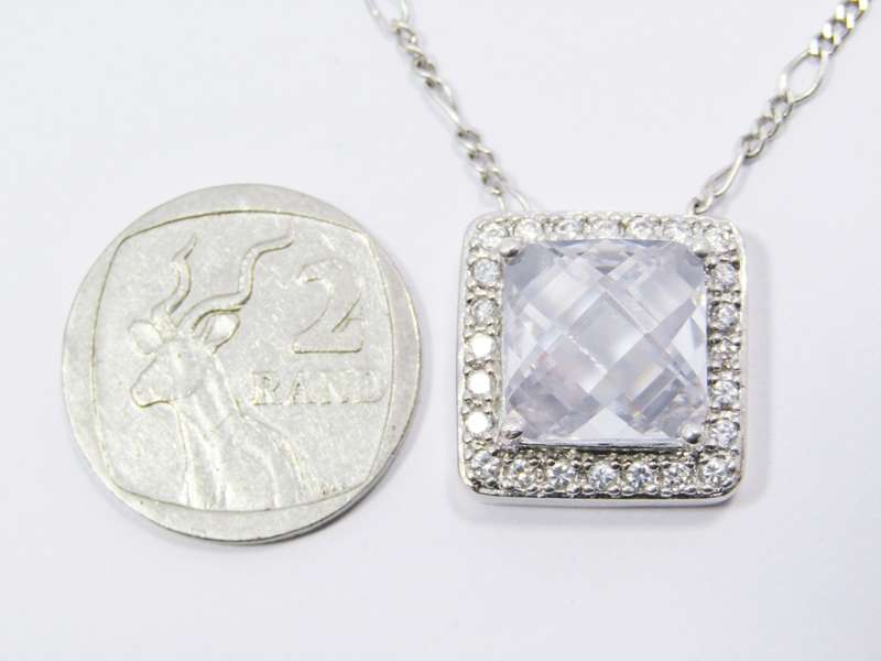 A Lovely Square Zirconia Pendant On Chain in Sterling Silver.
