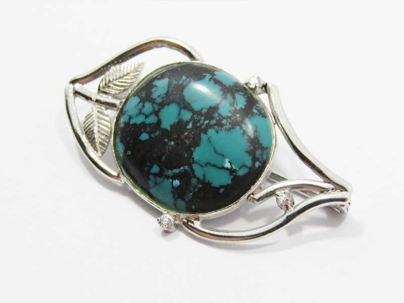 A Stunning Brooch With a Large Faux Turquois Stone in Sterling Silver.