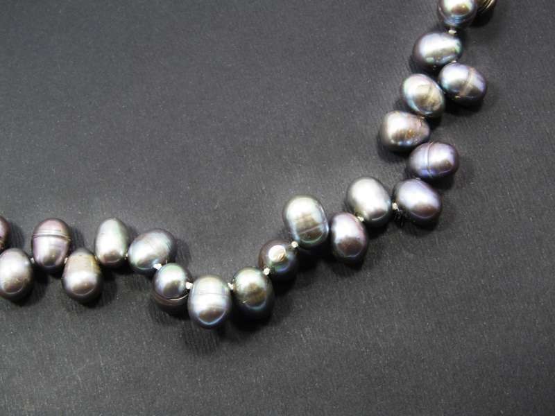 A Gorgeous String of Fresh Water Peacock Pearls With a Sterling Silver Clasp