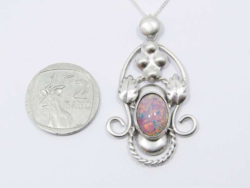 A Beautiful Vintage Design Art Glass Pendant On Chain in Sterling Silver.
