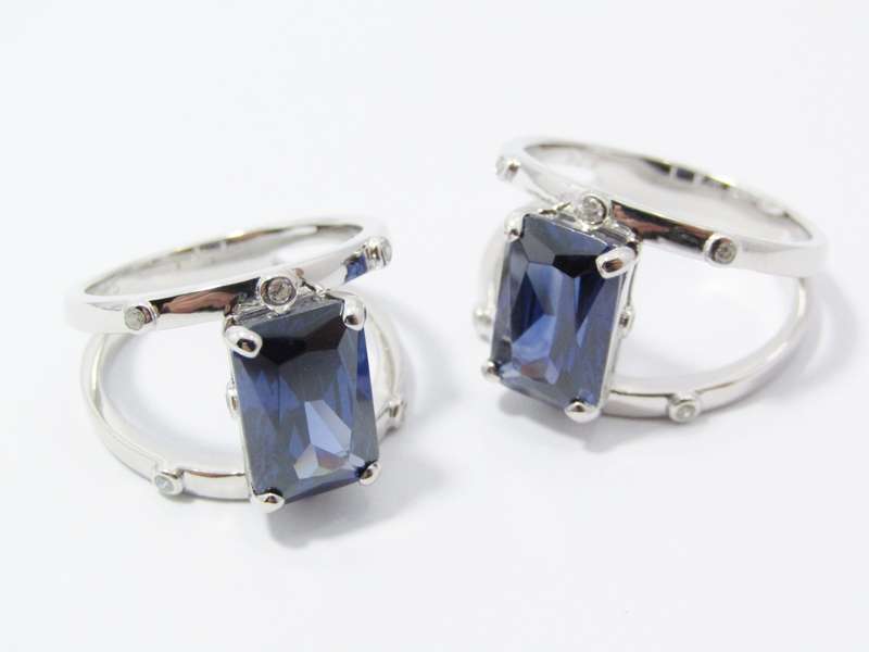 A Beautiful Double Row Into One Band Blue  Zirconia Ring in Sterling Silver.