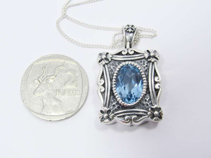 A Spectacular Blue Zirconia  Pendant On Chain in Sterling Silver.