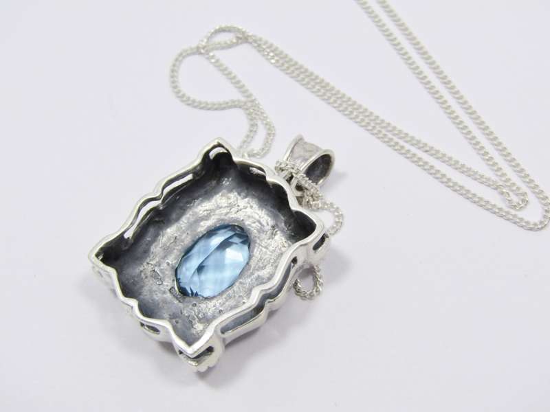 A Spectacular Blue Zirconia  Pendant On Chain in Sterling Silver.