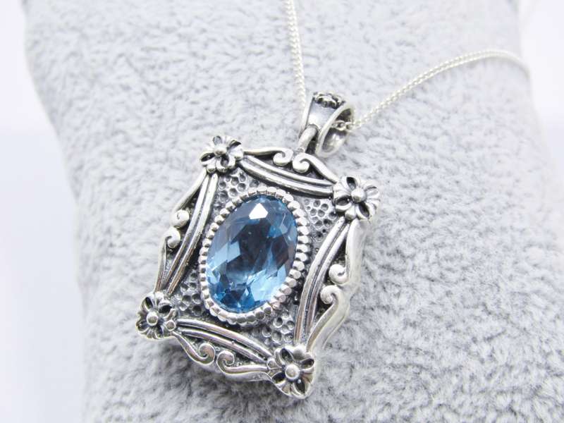 A Spectacular Blue Zirconia  Pendant On Chain in Sterling Silver.