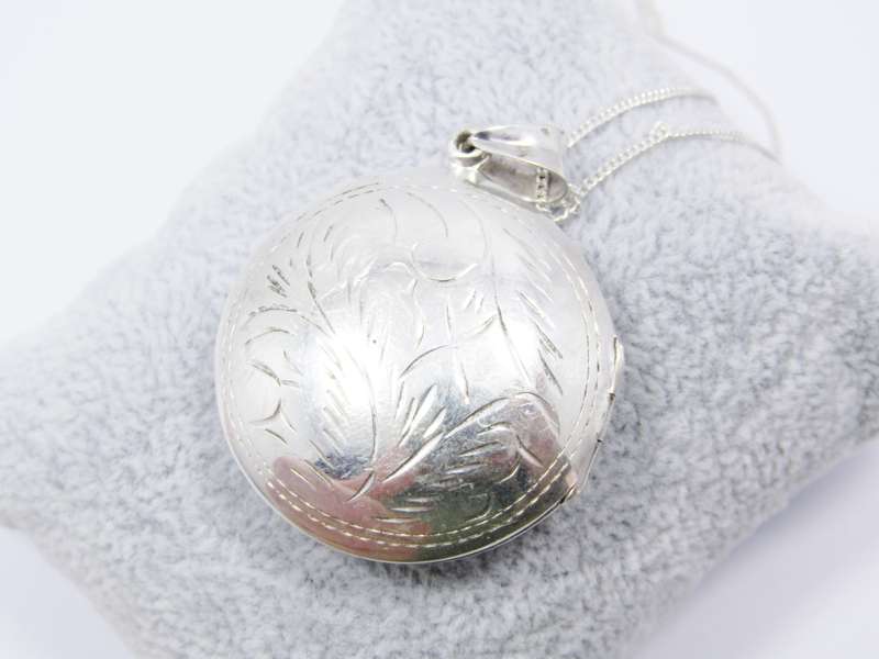 A Gorgeous Domed Vintage Design Locket On Chain in Sterling Silver.