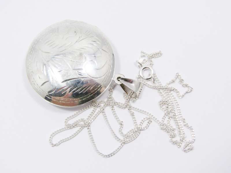 A Gorgeous Domed Vintage Design Locket On Chain in Sterling Silver.