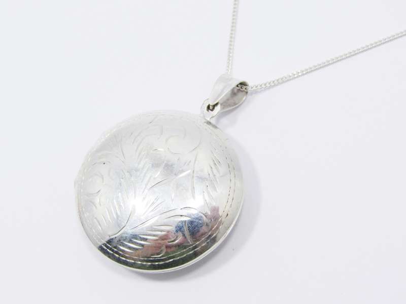 A Gorgeous Domed Vintage Design Locket On Chain in Sterling Silver.