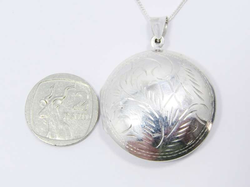 A Gorgeous Domed Vintage Design Locket On Chain in Sterling Silver.