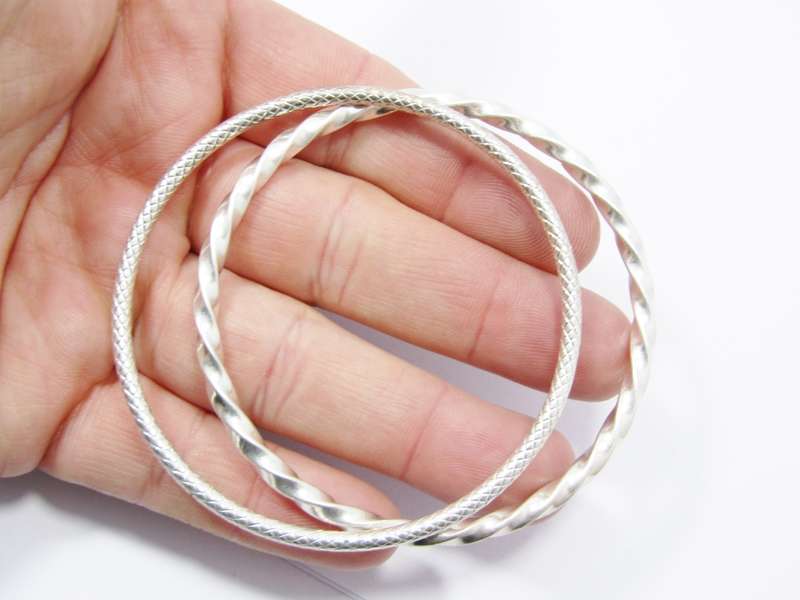 Two Lovely Textured  Stack Bangles in Sterling Silver.