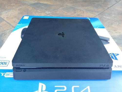 PS4 Slim Console, 2x Original Remotes, 4x Games