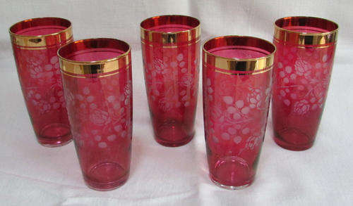 5 BOHEMIAN CRANBERRY COLOURED TALL GLASSES WITH GOLD RIM