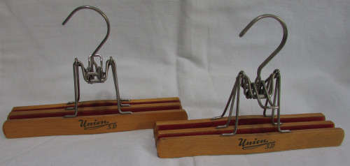 2 Wooden Trouser Hangers holding 2 pairs of Trousers