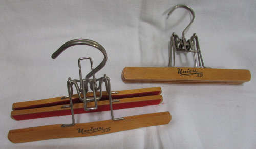 2 Wooden Trouser Hangers holding 2 pairs of Trousers