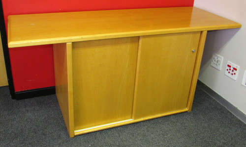 MAPLE CREDENZA WITH EXTRA LONG OVERHANGING TOP