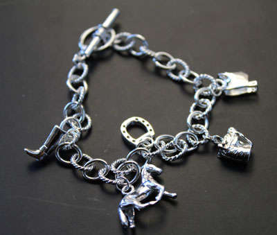 STUNNING STERLING SILVER CHARM BRACELET
