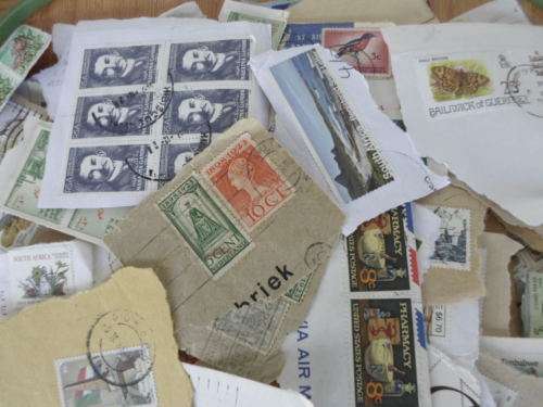 1000 X WORLD USED STAMPS ON PAPER SEE PICS!!!