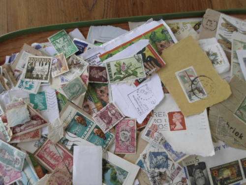 1000 X WORLD USED STAMPS ON PAPER SEE PICS!!!