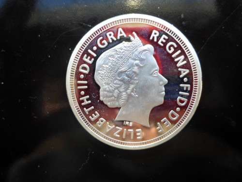 QUEEN ELIZABETH  2010 SILVER PLATED UNCIRCULATED COIN IN PLASTIC SLEEVE SEE PICS!!!