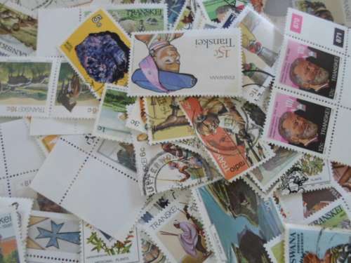 500 X TRANSKEI AND BOTSWANA MINT AND USED STAMPS OFF PAPER
