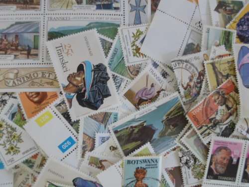 500 X TRANSKEI AND BOTSWANA MINT AND USED STAMPS OFF PAPER