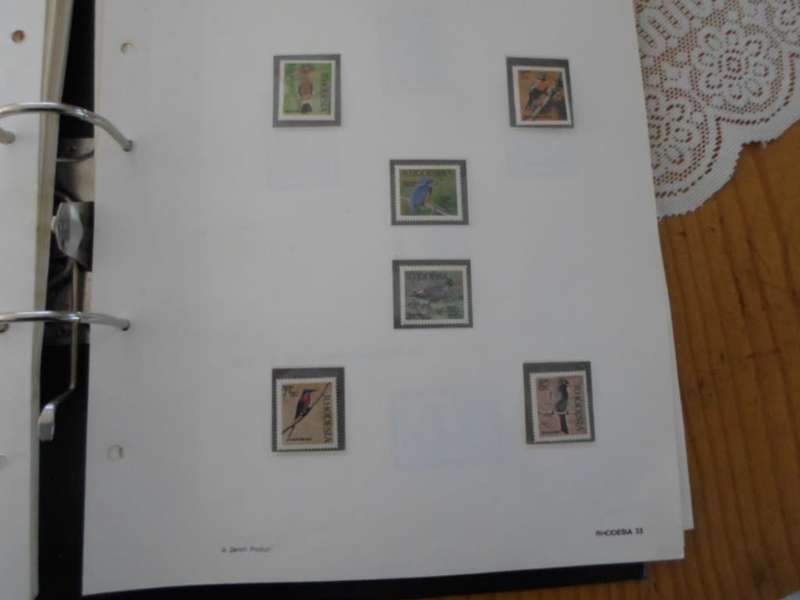 FILE RHODESIA MINT STAMPS ONLY SOME PAGES SCANNED SEE PICS