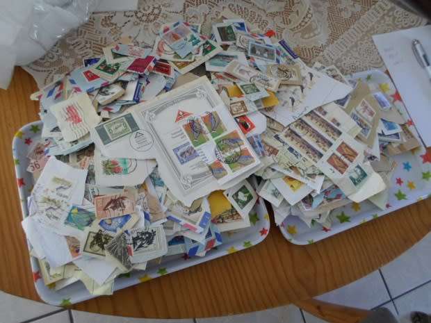 MIXED WORLD STAMPS USED ON PAPER 300 NEAT LOT SEE PICS