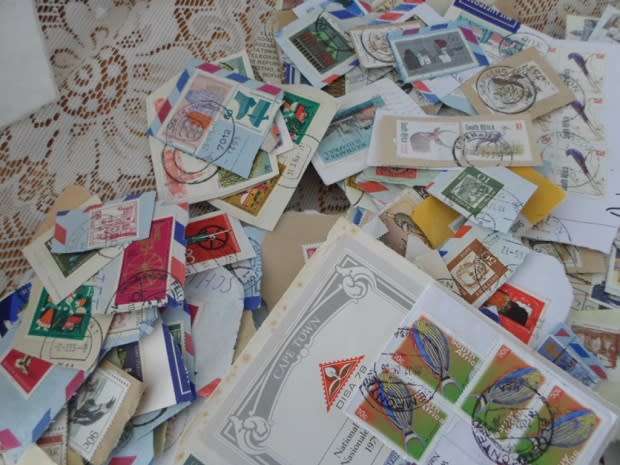 MIXED WORLD STAMPS USED ON PAPER 300 NEAT LOT SEE PICS