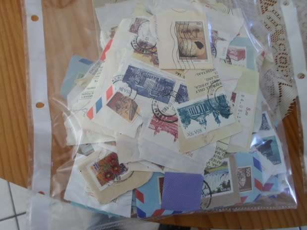 MIXED WORLD STAMPS USED ON PAPER 300 NEAT LOT SEE PICS