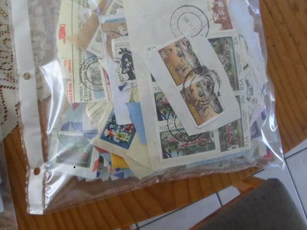 MIXED WORLD STAMPS USED ON PAPER 300 NEAT LOT SEE PICS