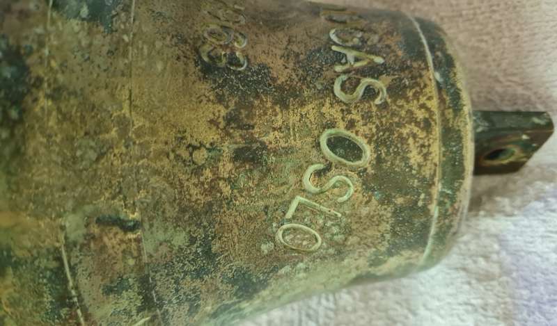 Salvaged ships brass bell from  the Mundogas Oslo