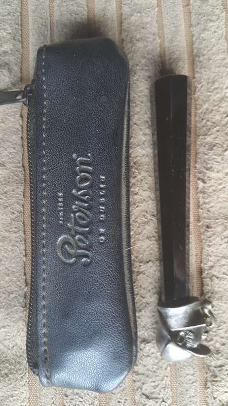 Peterson tobacco tamper with leather holder