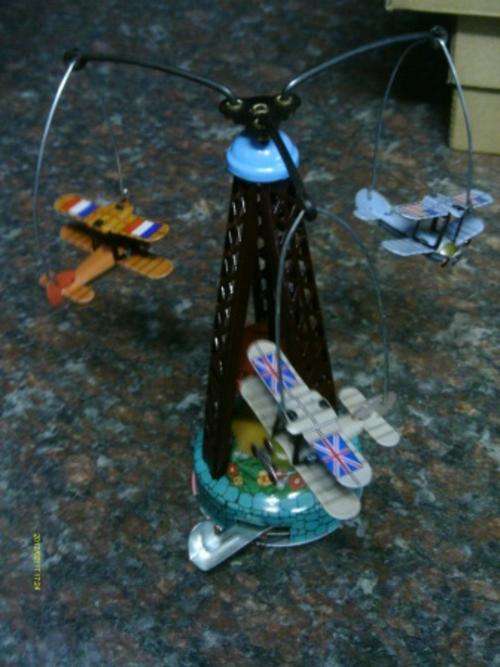 Metal wind up plane carousel