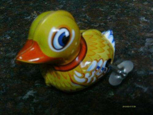 Metal wind up duck.