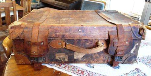 ** VINTAGE LEATHER SUITCASE WITH BITS AND PIECES OF S.A.R. LABLES**
