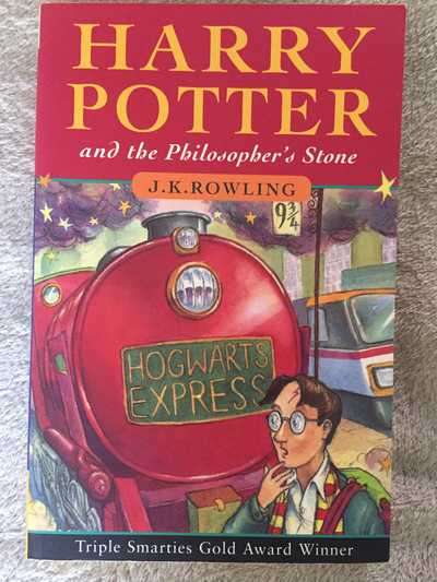 BOOK (SOFT COVER) - HARRY POTTER AND THE PHILOSOPHER'S STONE