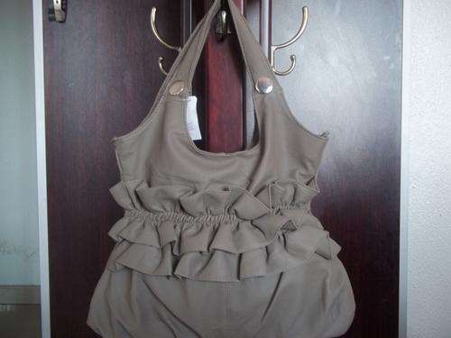 **Gorgeous ladies hand bag in TAN. Trendy and fashionable. A great Buy!