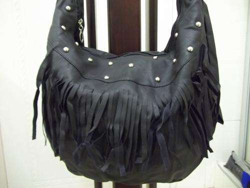 last one**Beautiful ladies Soft leather look hand bag in BLACK !. Great everyday hand bag.