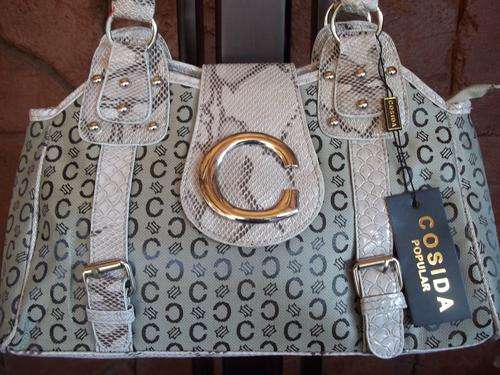 **CLEARANCE SALE**Gorgeous ladies hand band in LIGHT BROWN. Trendy and fashionable. A great Buy!