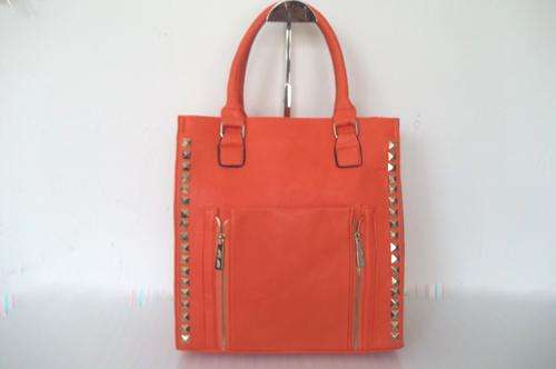 Late entry**Stunning Ladies bonded leather Bag in Orange with gold studs. Excellent quality!
