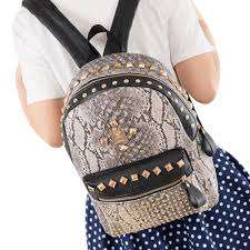*NEW ARRIVALS*Stunning Ladies Back pack in mock snake skin leather with studs- Excellent quality!.