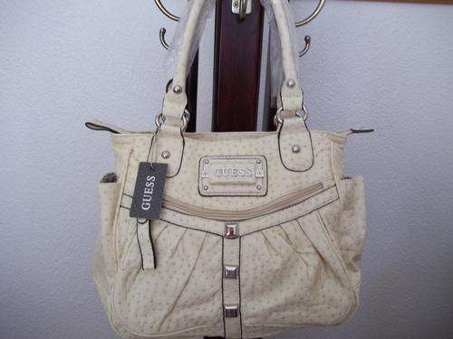 Elegant and stylist GUESS ladies Hand bag in a gorgeous Cream & Black. Faux ostrich leather.