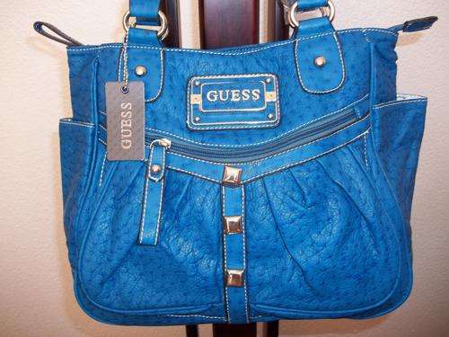 Elegant and stylist GUESS ladies Hand bag in a gorgeous Blue.