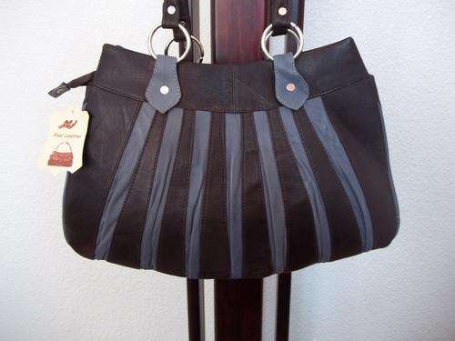 Stunning 100%  Genuine leatherHand Bag in Beautiful in Black and grey and Brown. Great modern look!!