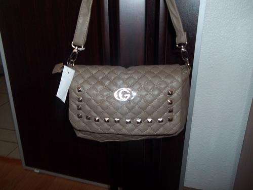 Beautiful designer style ladies Soft leather look hand bag in  TAN BROWN padded style. Very elegant