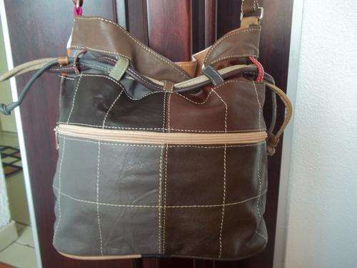 Beautiful draw-string, patch 100%  Genuine leather  Hand Bag. Invest in leather, the smart choice.