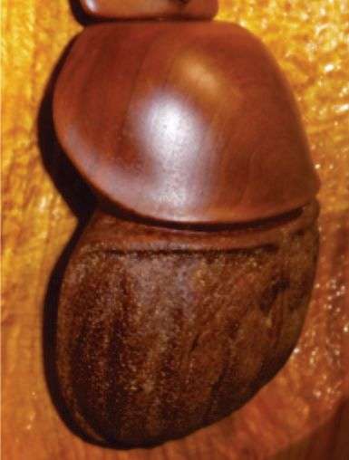 Cherry wood Scarab on Poplar backer.