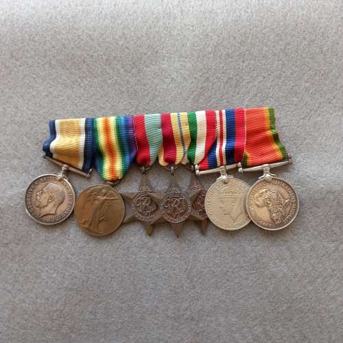 SET OF 7 MEDALS COMPLETE WITH RIBBONS AND BAR. J.N. GIRVIN. No. 233656. WW1 and WW2 ON SET