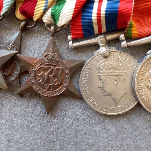 SET OF 7 MEDALS COMPLETE WITH RIBBONS AND BAR. J.N. GIRVIN. No. 233656. WW1 and WW2 ON SET